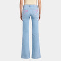 Back view of 7 For All Mankind Air Haze Dojo light wash flare jeans with faded pink 7 pockets – Seven Acres Canada